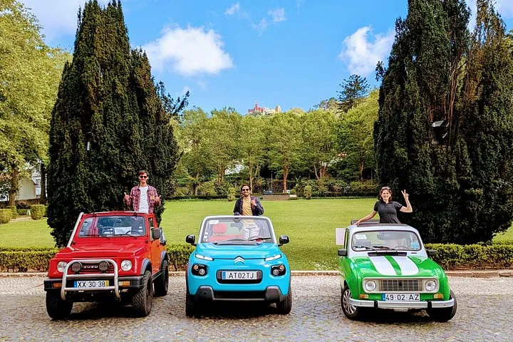 Portela station: vintage car or open jeep with a local, photo 2